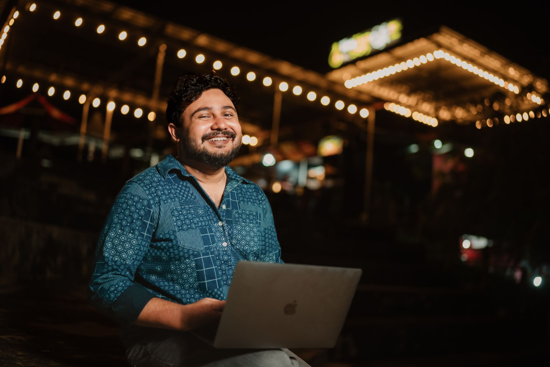 Content creator working on a laptop reviewing video content for publication