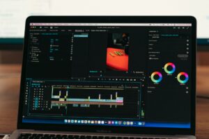 A content creator reviewing video clips on a computer screen for social media publishing