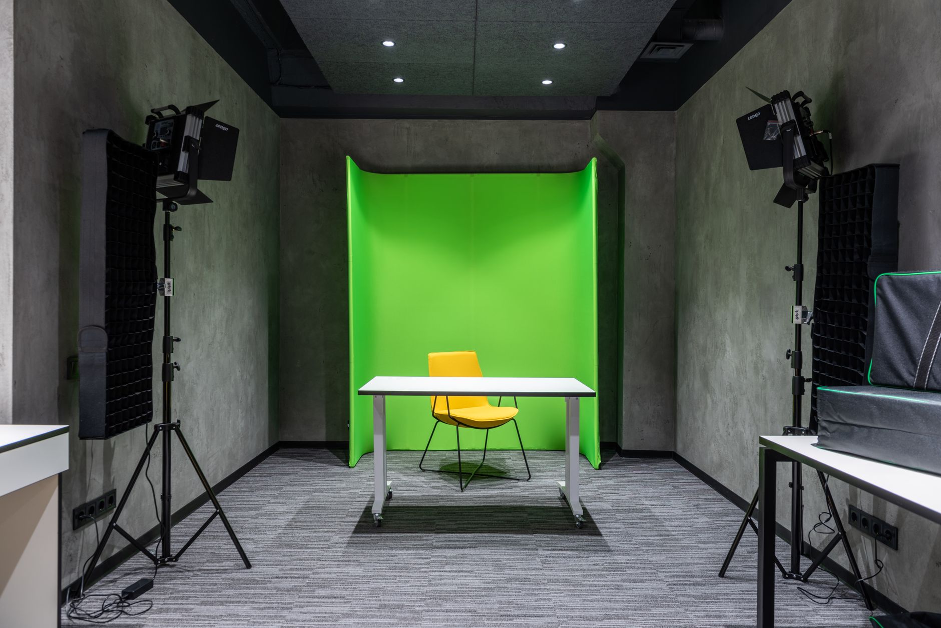 A marketing professional working at a desk with video editing software open on screen