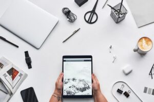 A clean desk setup with laptop and digital workspace tools open on screen