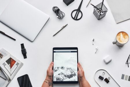 A clean desk setup with laptop and digital workspace tools open on screen