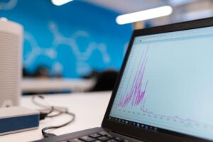 A laptop screen displaying data and analytics dashboards used for outbound marketing