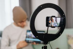 Person editing a short-form video on a smartphone with caption tools visible on screen