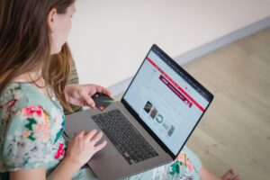 A laptop screen showing a website design interface with colorful layout elements