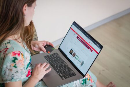 A laptop screen showing a website design interface with colorful layout elements
