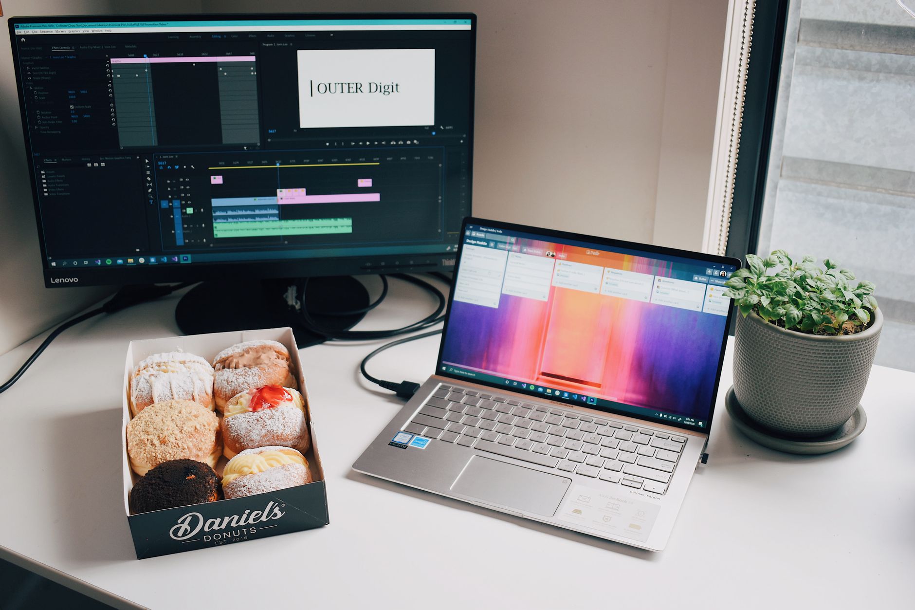 A content creator editing video clips at a desktop workstation