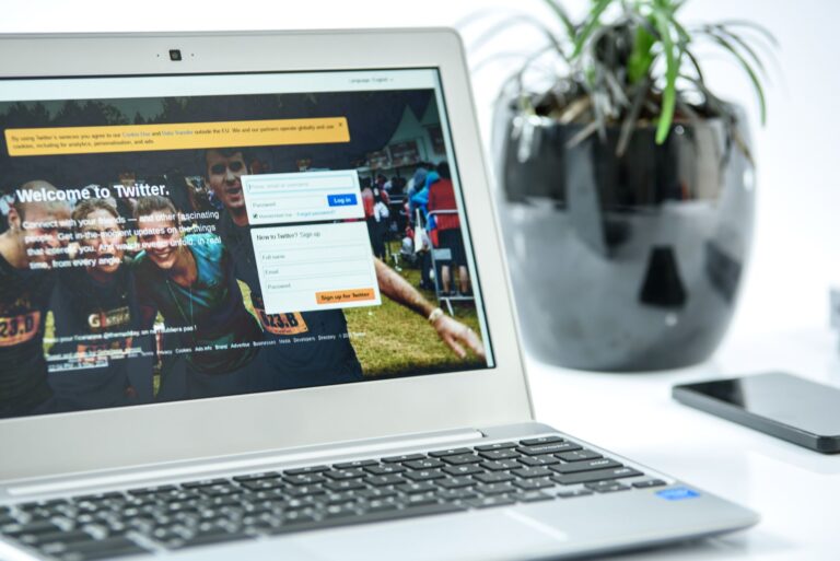Person working on a laptop with social media content open on screen
