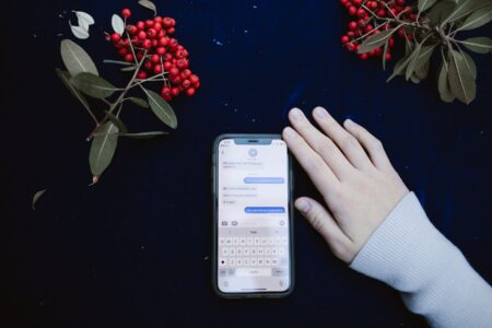 Close-up of a smartphone screen showing a chat conversation interface