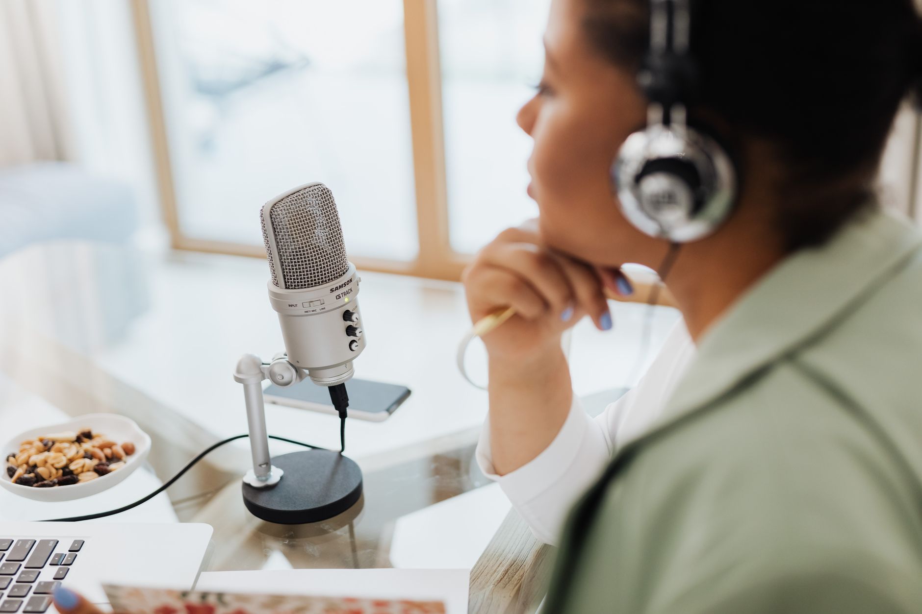 A podcaster recording long-form video content that will later be repurposed into short clips