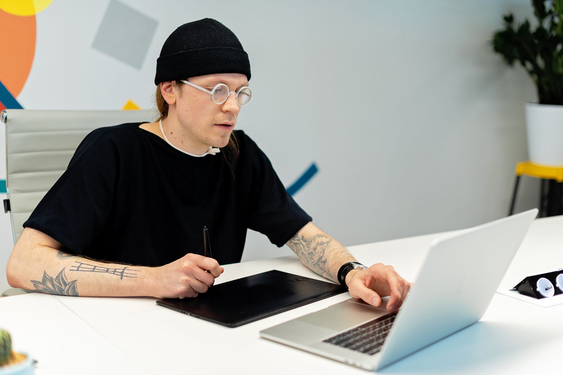 A designer working on a laptop building animated content for social media campaigns