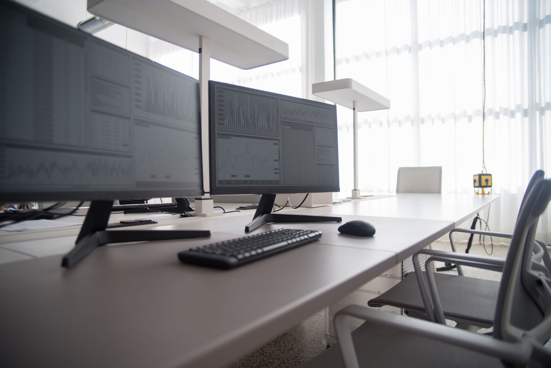 A designer working on image assets at a bright modern workstation