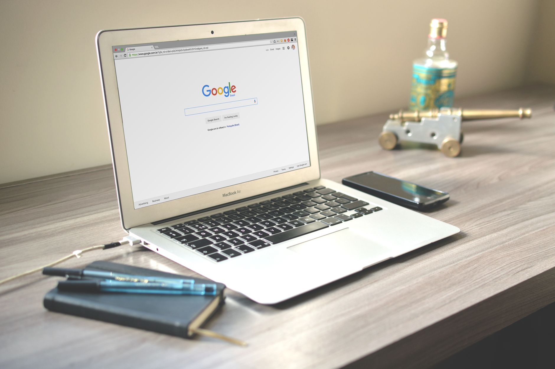 A tidy desk workspace with multiple digital tools open on a computer screen
