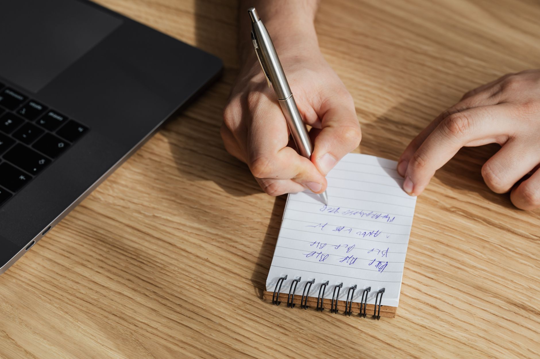 Professional reviewing notes and task lists during a campaign planning meeting