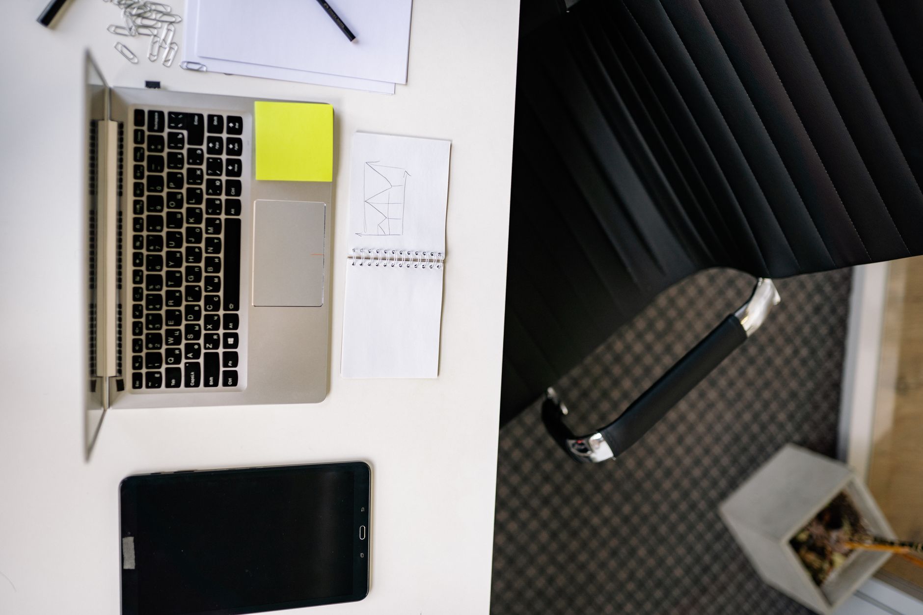 Professional workspace with computer screen showing a slide presentation