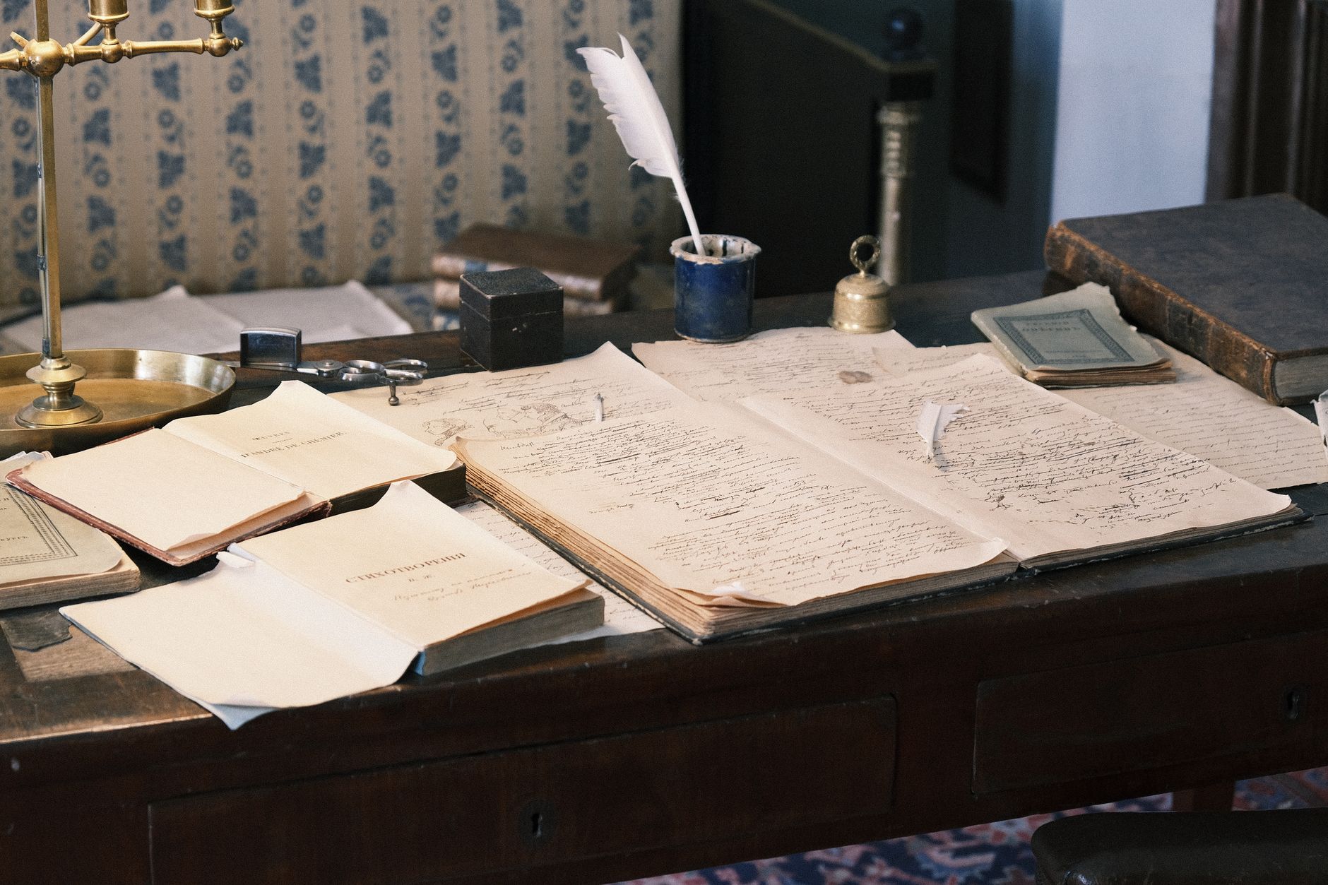 Writer working at a desk with a laptop open to a content planning document