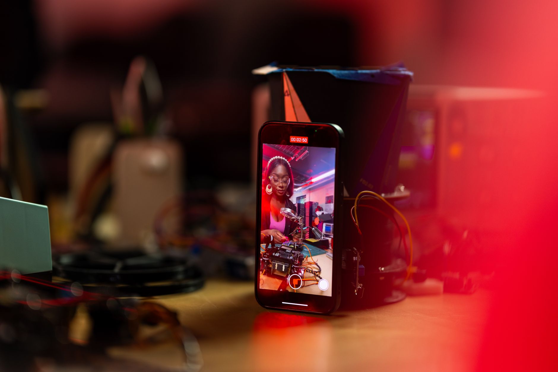 A video creator recording content in a home studio setup