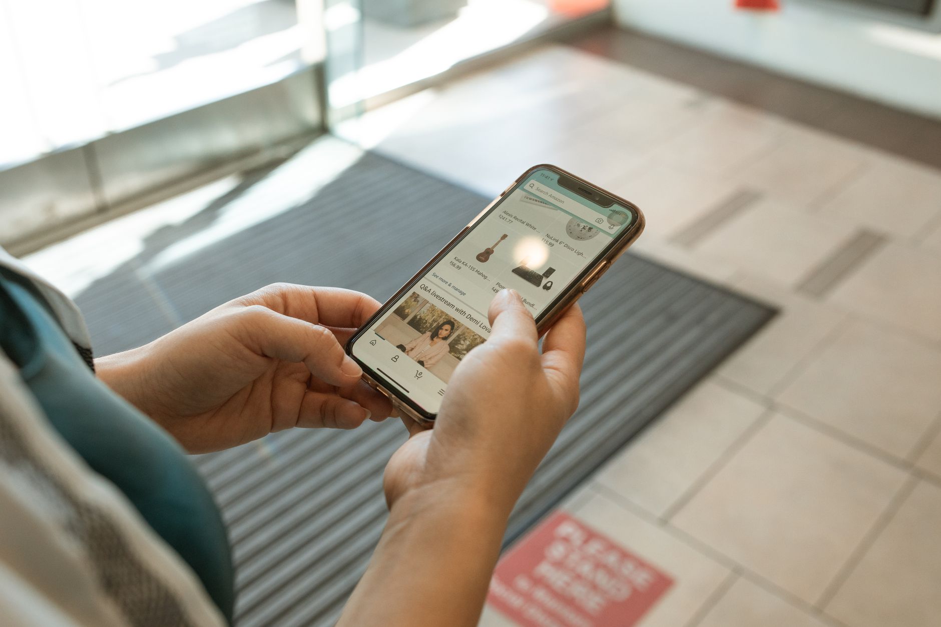Person browsing an online shop on a mobile device