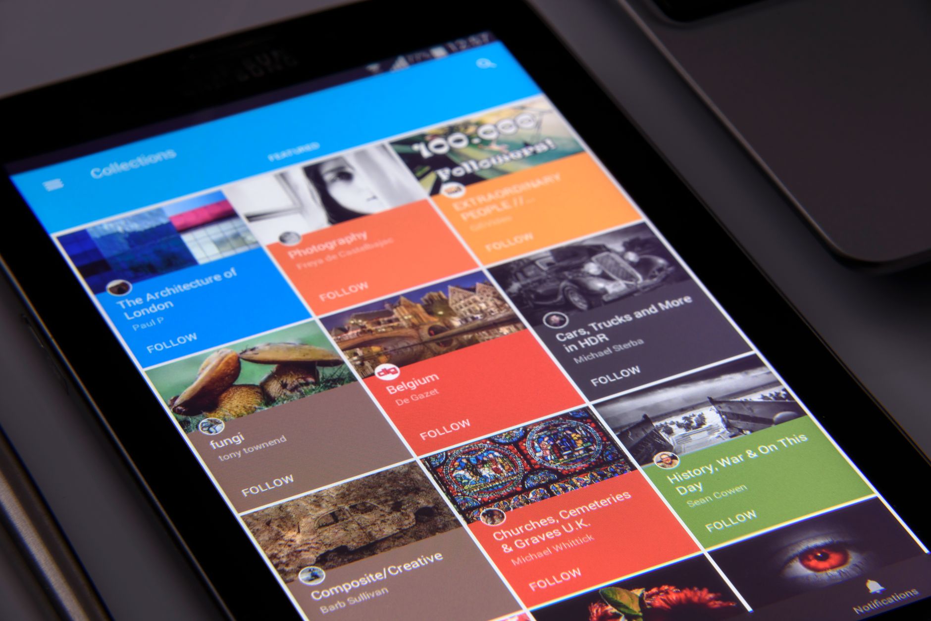 A smartphone displaying a grid layout of social media posts for a brand account
