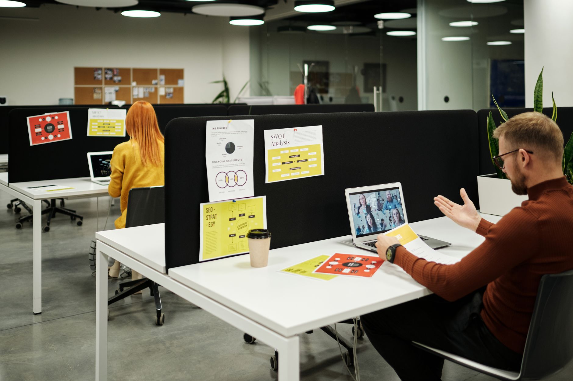 A small marketing team reviewing lead data together at an office desk