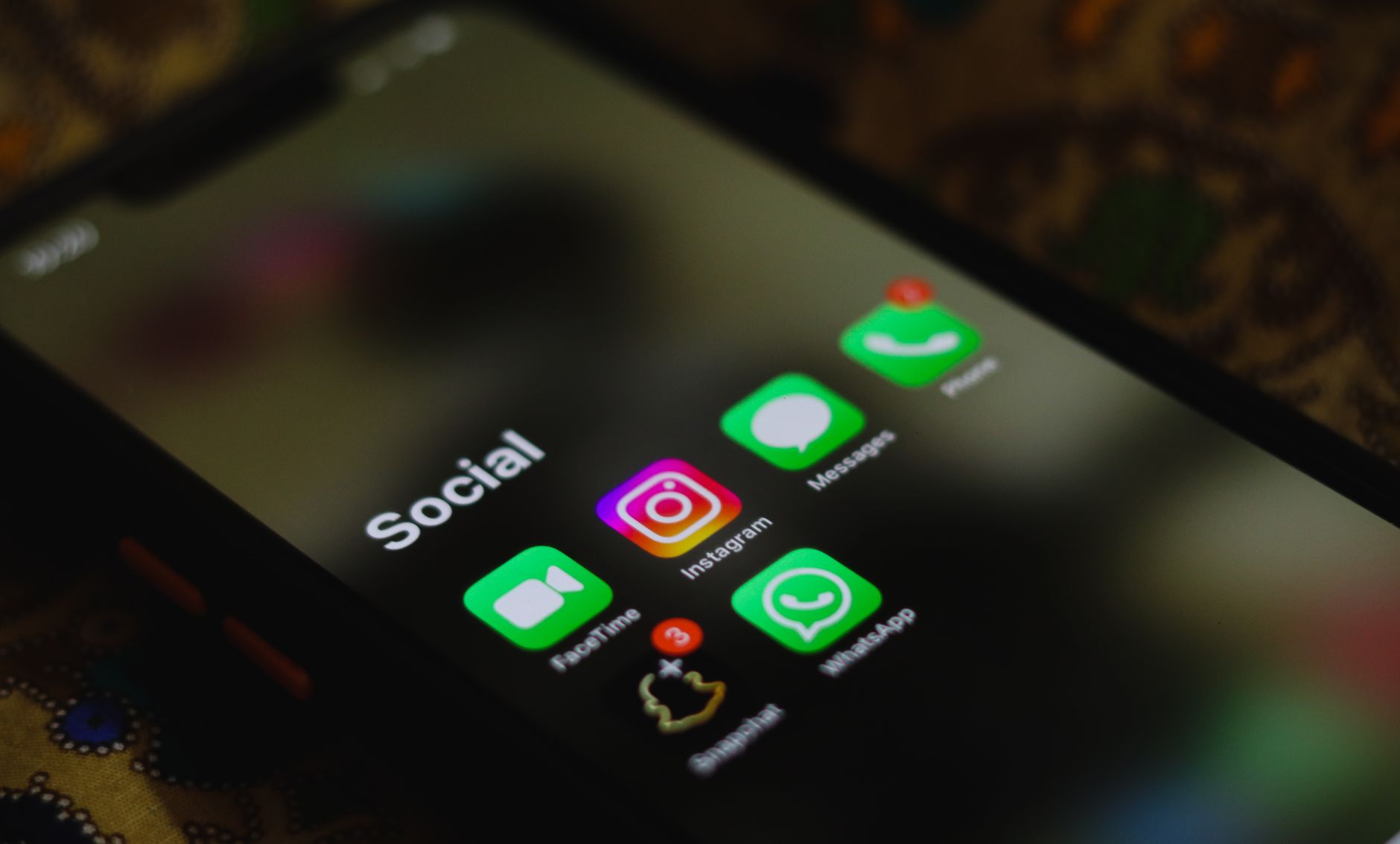 Person scrolling a social media landing page on a smartphone