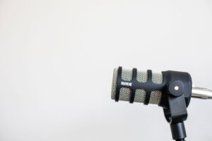 Close-up of a condenser microphone in a home recording setup