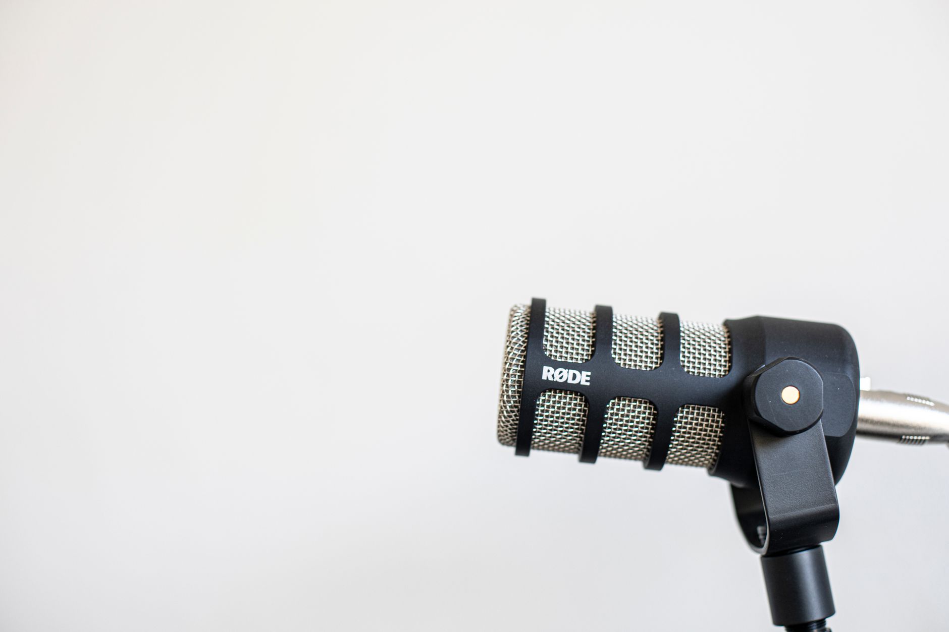 Close-up of a condenser microphone in a home recording setup