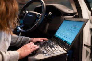 A laptop screen showing a social proof dashboard interface used by SaaS marketing teams