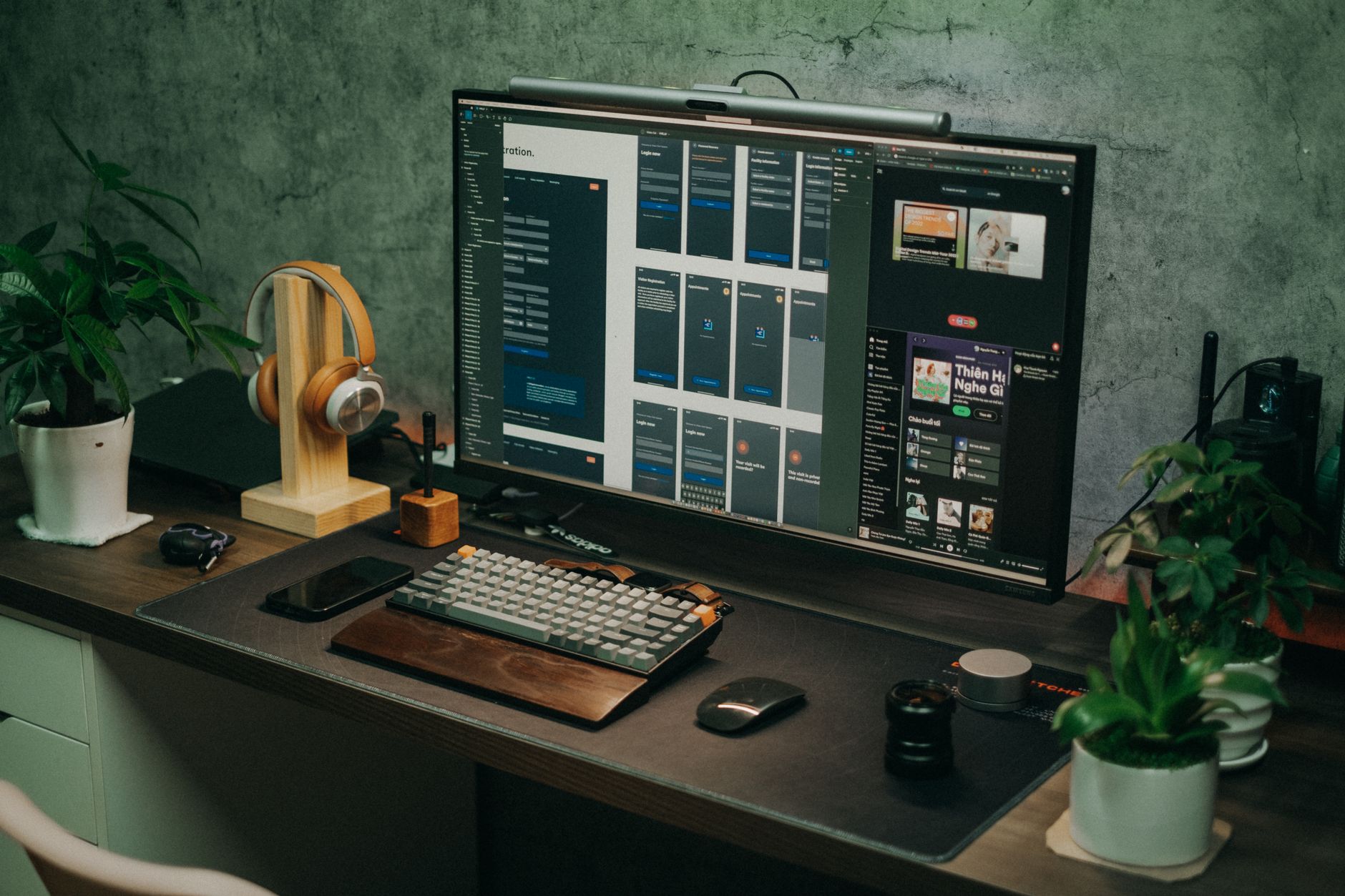 A solopreneur working at a minimalist desk with a laptop and social media analytics on screen