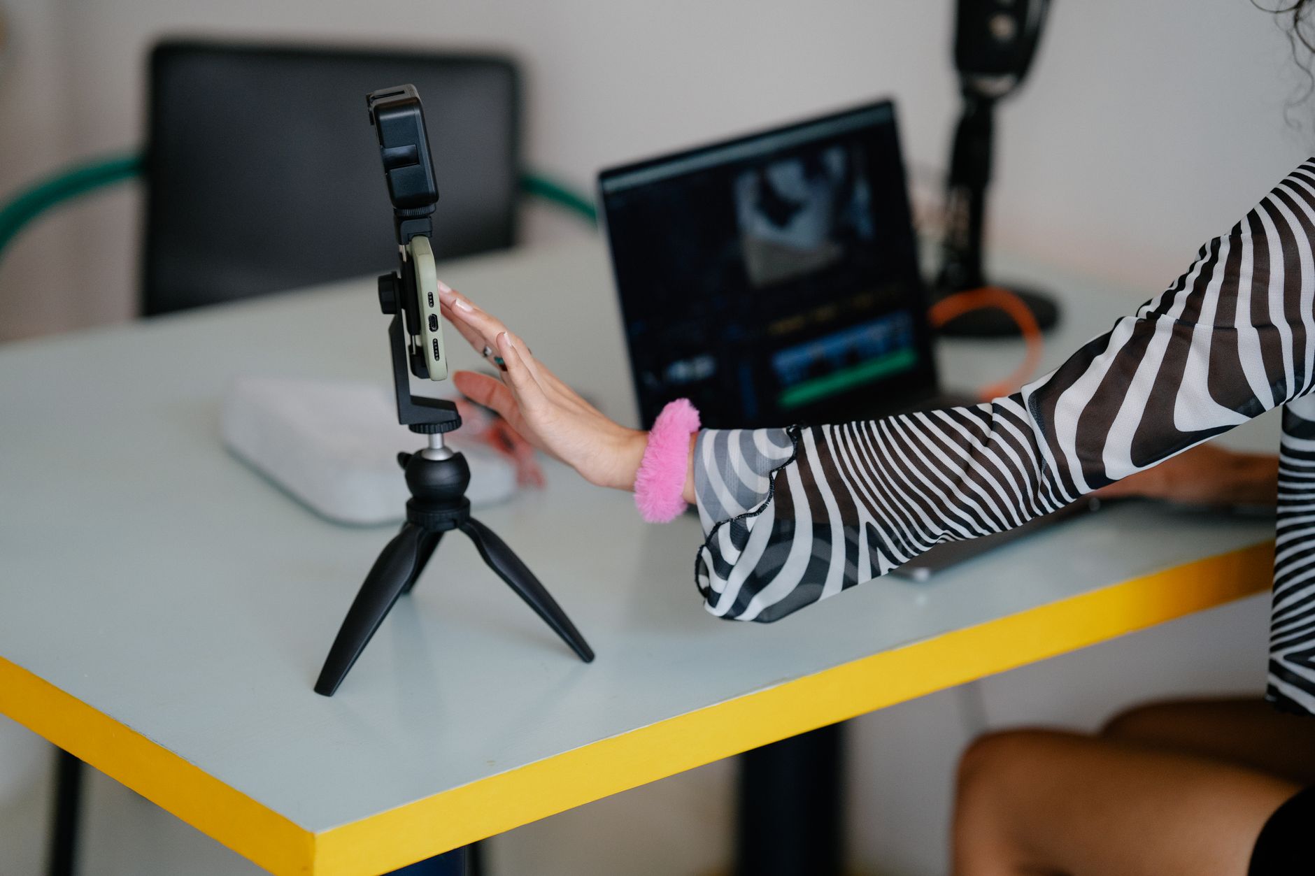 Content creator reviewing analytics and drafting posts on a computer