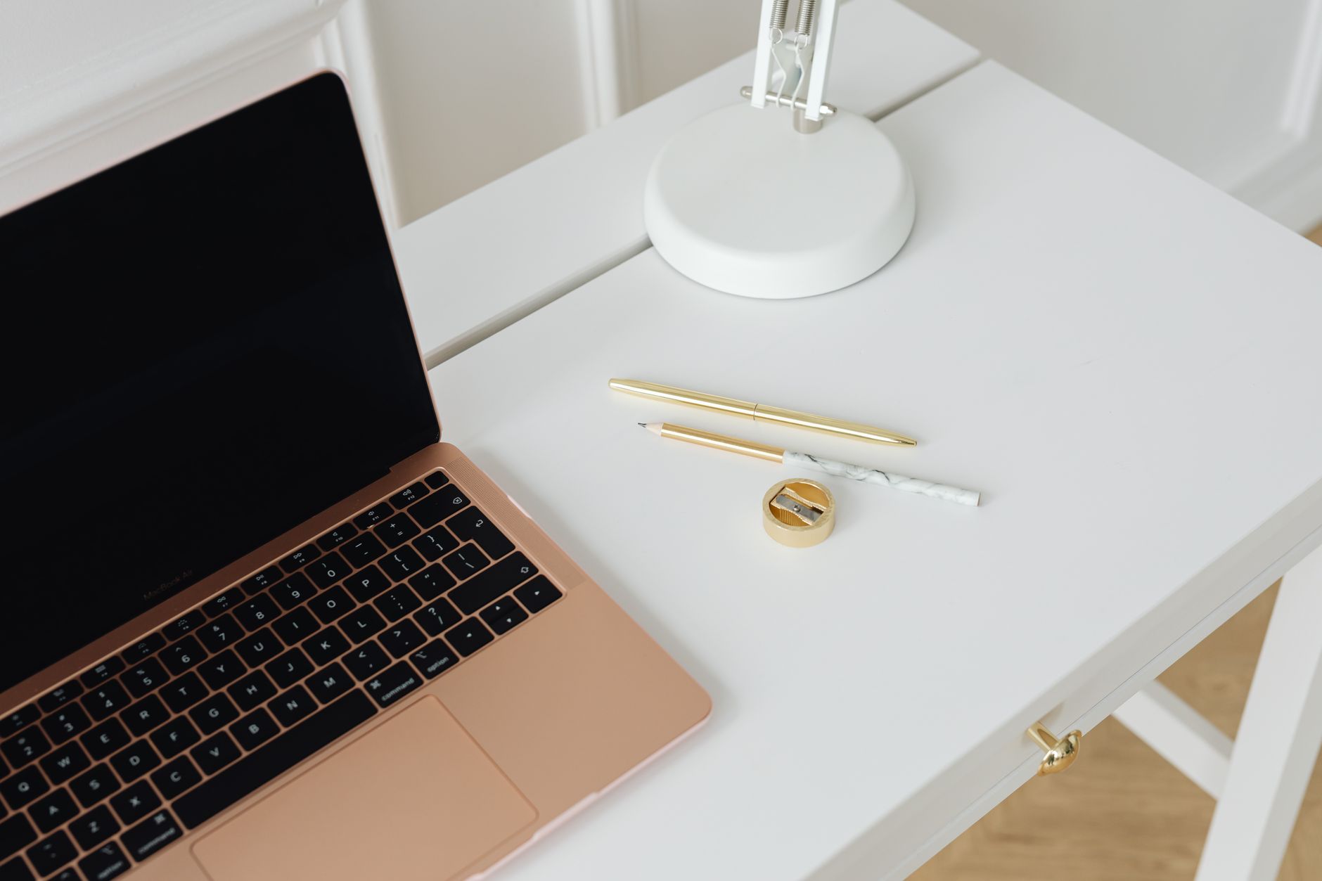 A writer working at a desk with a laptop and notes, representing AI-assisted copywriting