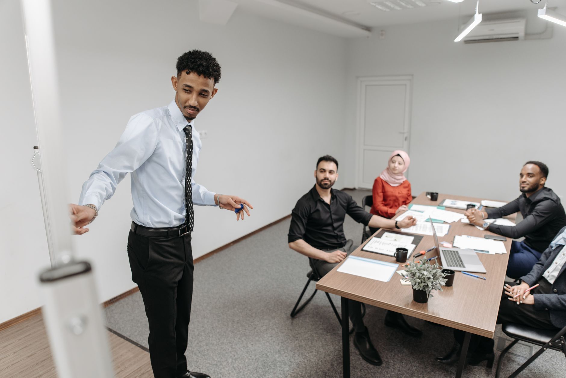 Business professionals reviewing an AI content platform during a team meeting