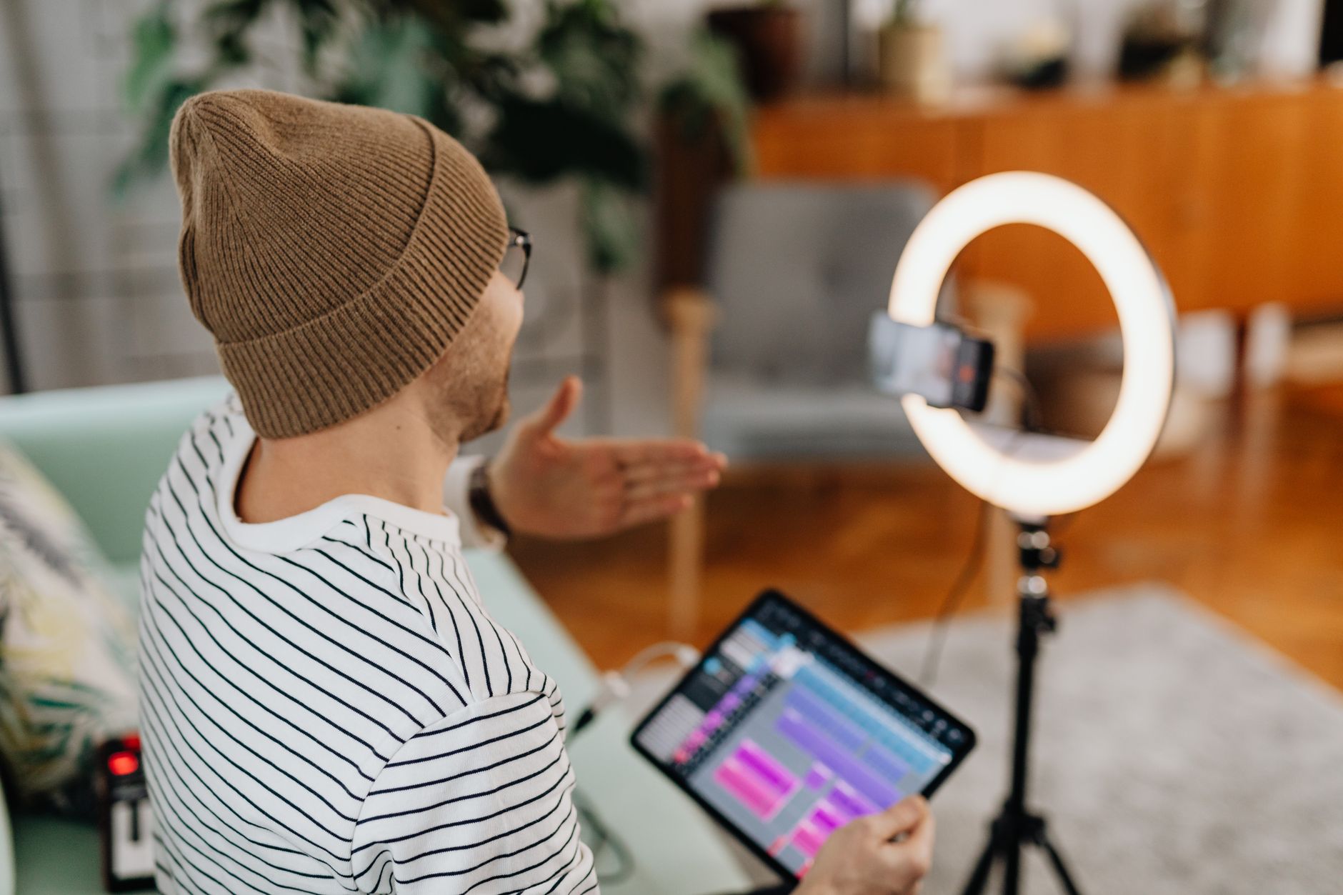 Content creator recording audio in a small home studio environment