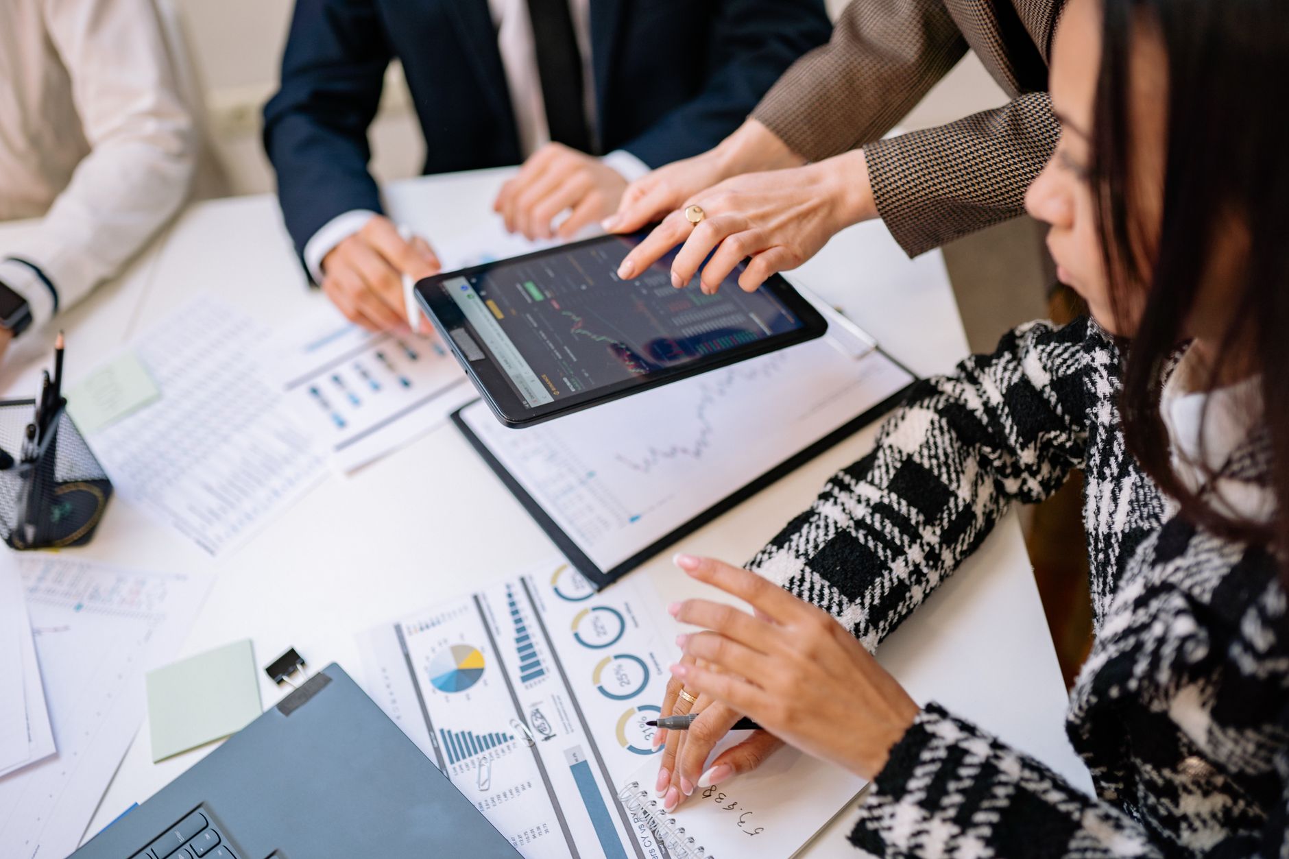Small business team discussing digital marketing strategy at a table