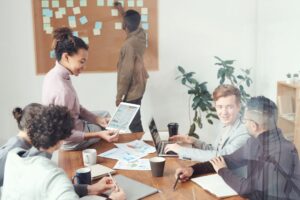 Foreplay’s Ad Library Is Quietly Replacing Swipe-Fu for Paid Social Teams Paid social team reviewing ad creative on computer screens in an office setting