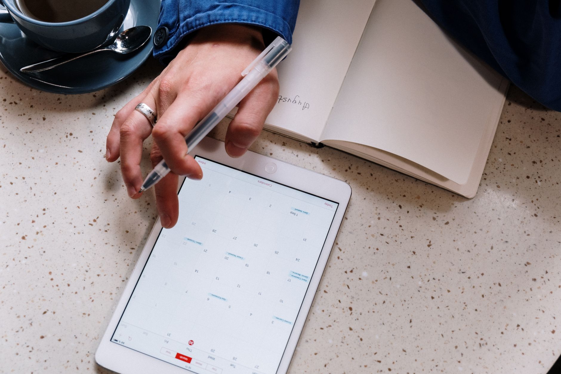 A person reviewing a social media content calendar on a computer screen
