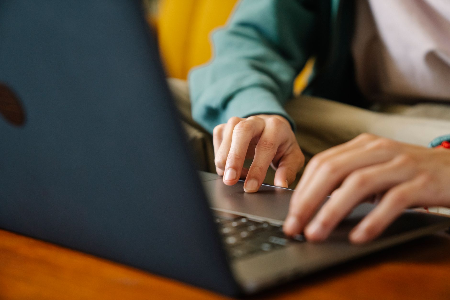 Creator typing profile bio on laptop at a desk