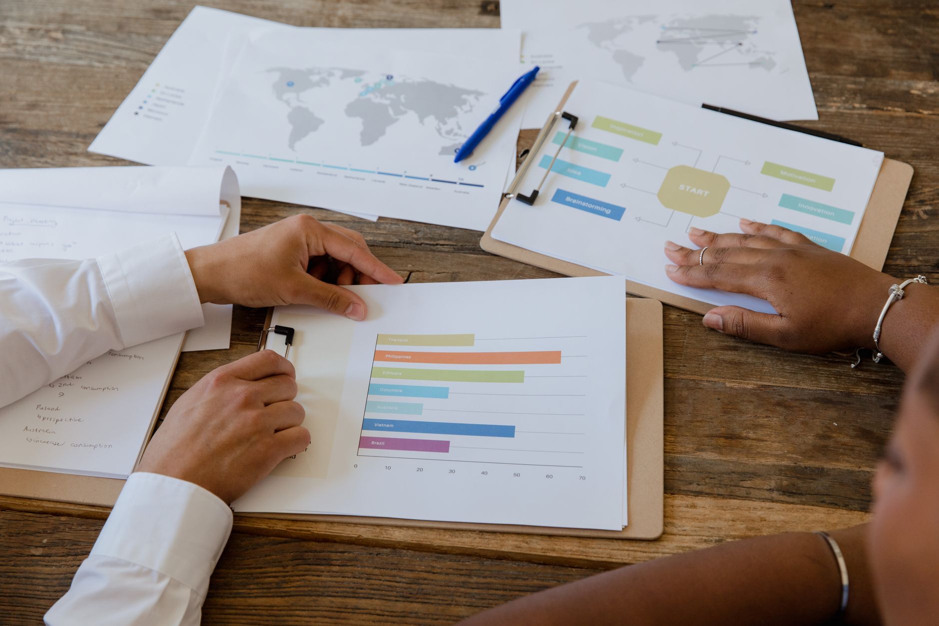 Small team reviewing content strategy on a shared screen in a modern office