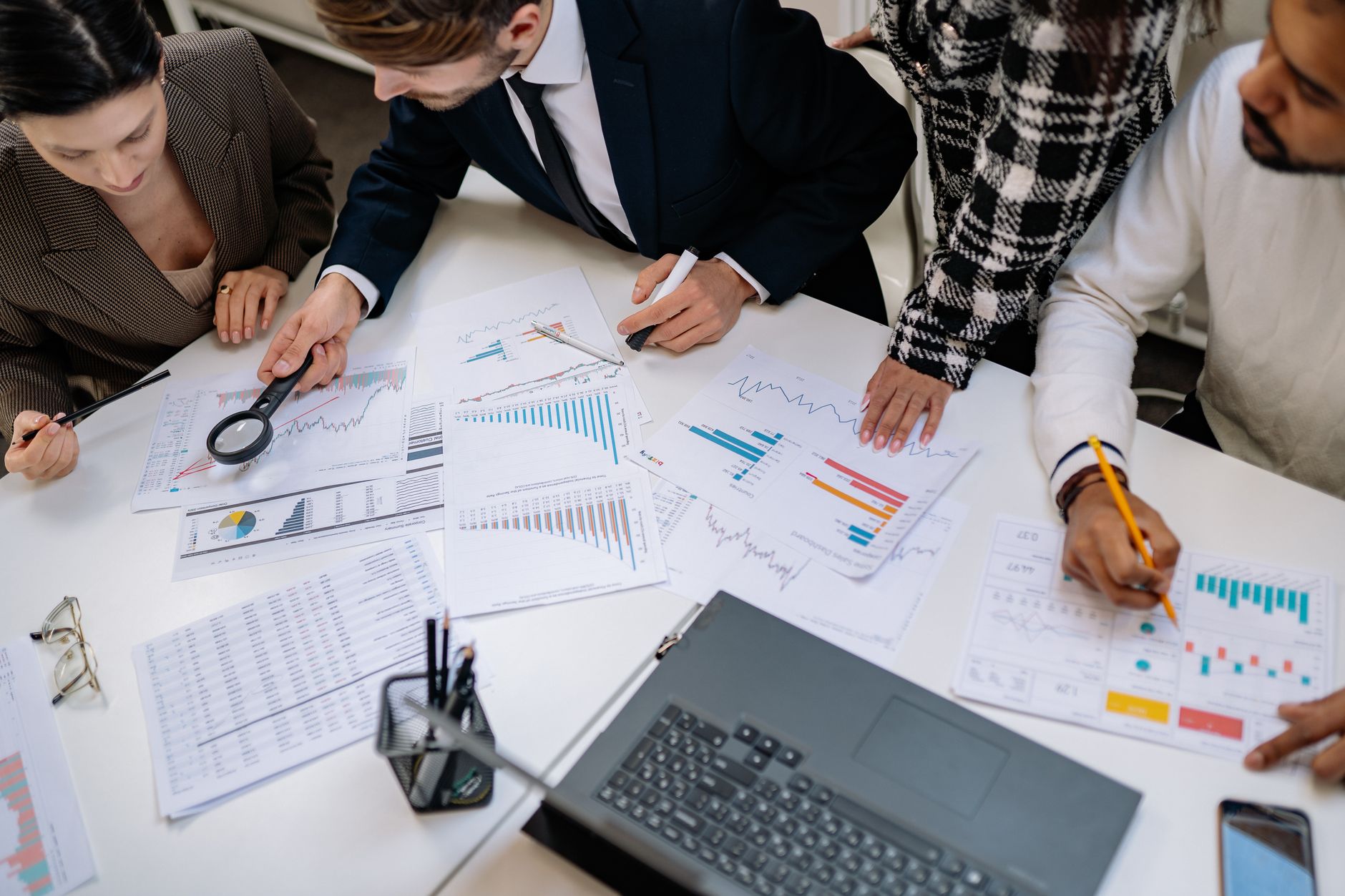 A social media team reviewing consumer research data together in a meeting room
