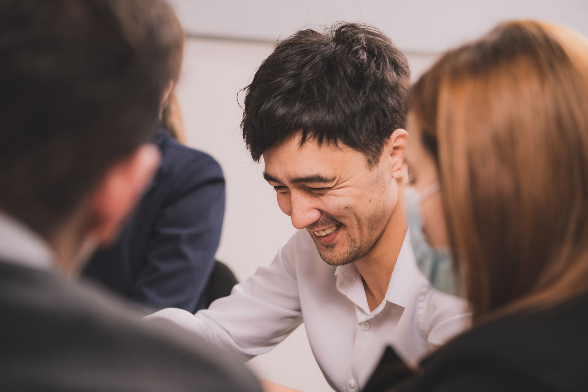 A B2B marketing team reviewing content on screens during a strategy meeting