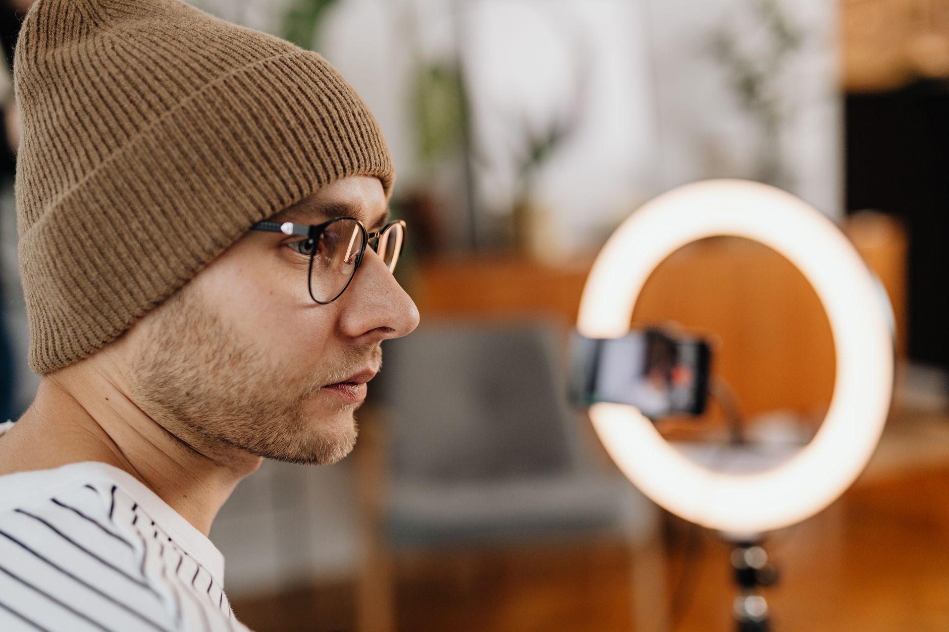 Content creator filming vertical video on a smartphone for social media Reels