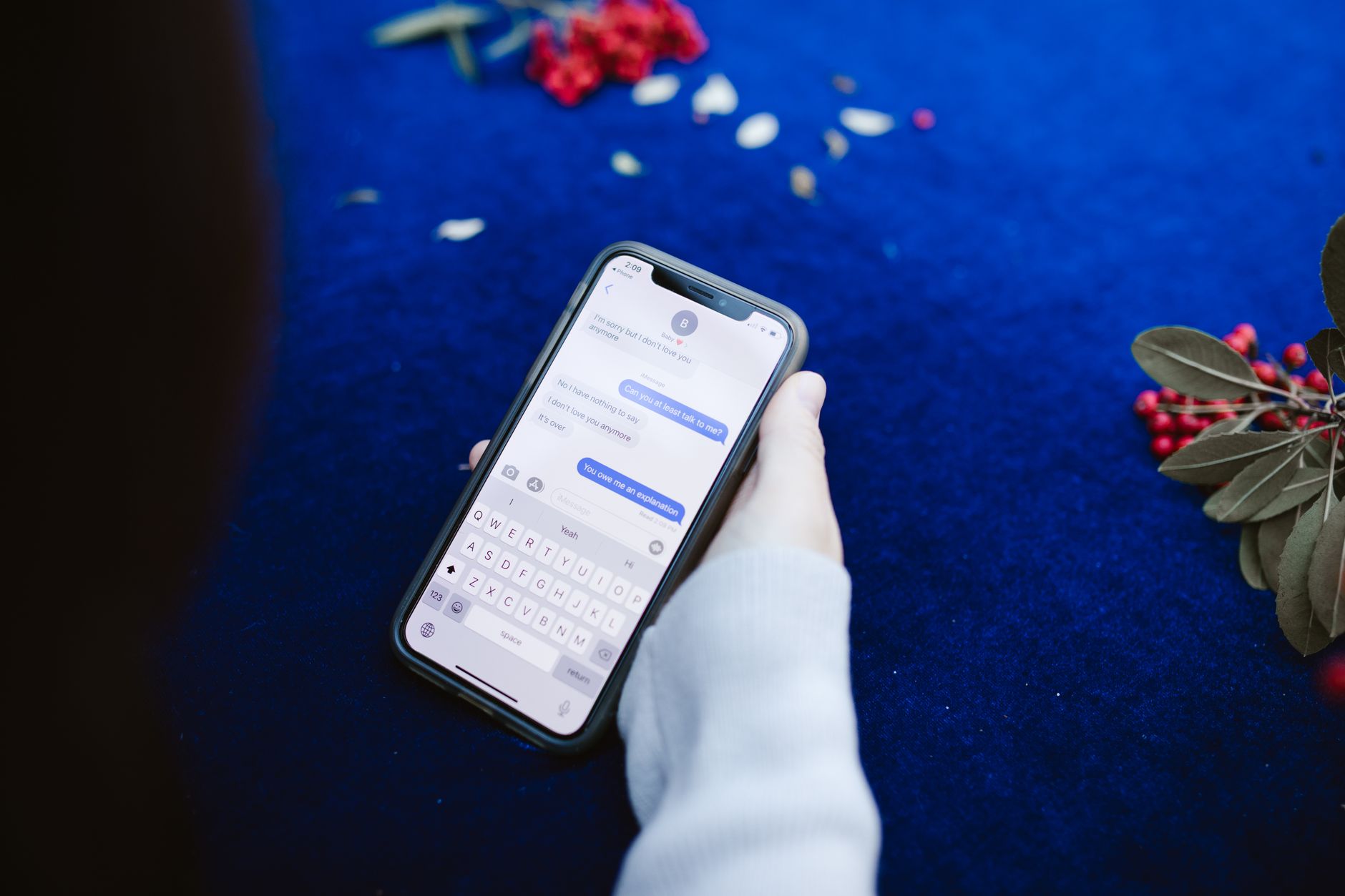 Person managing messages and social inbox on a smartphone
