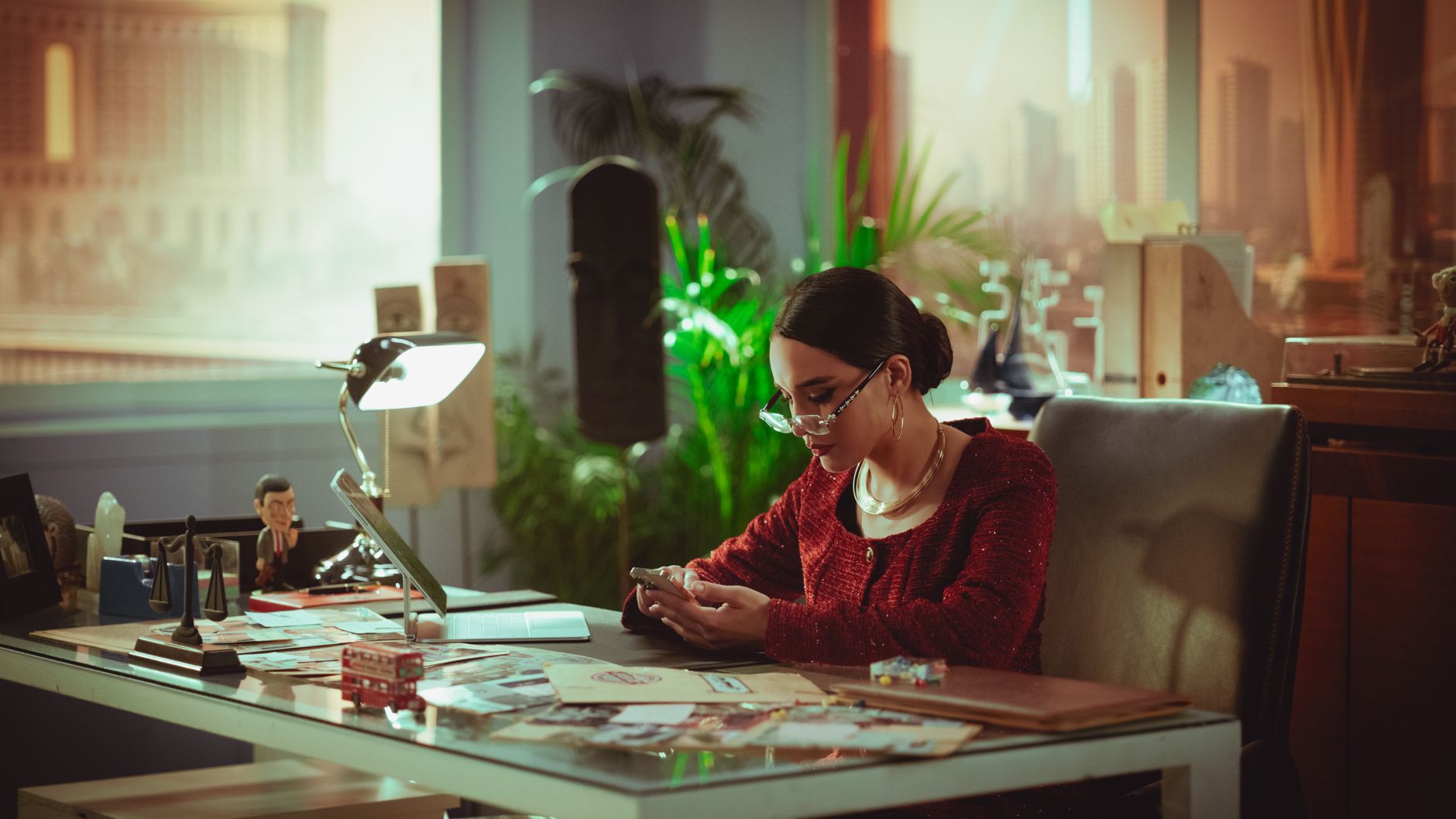 A business woman reviewing content strategy at her desk with a computer screen