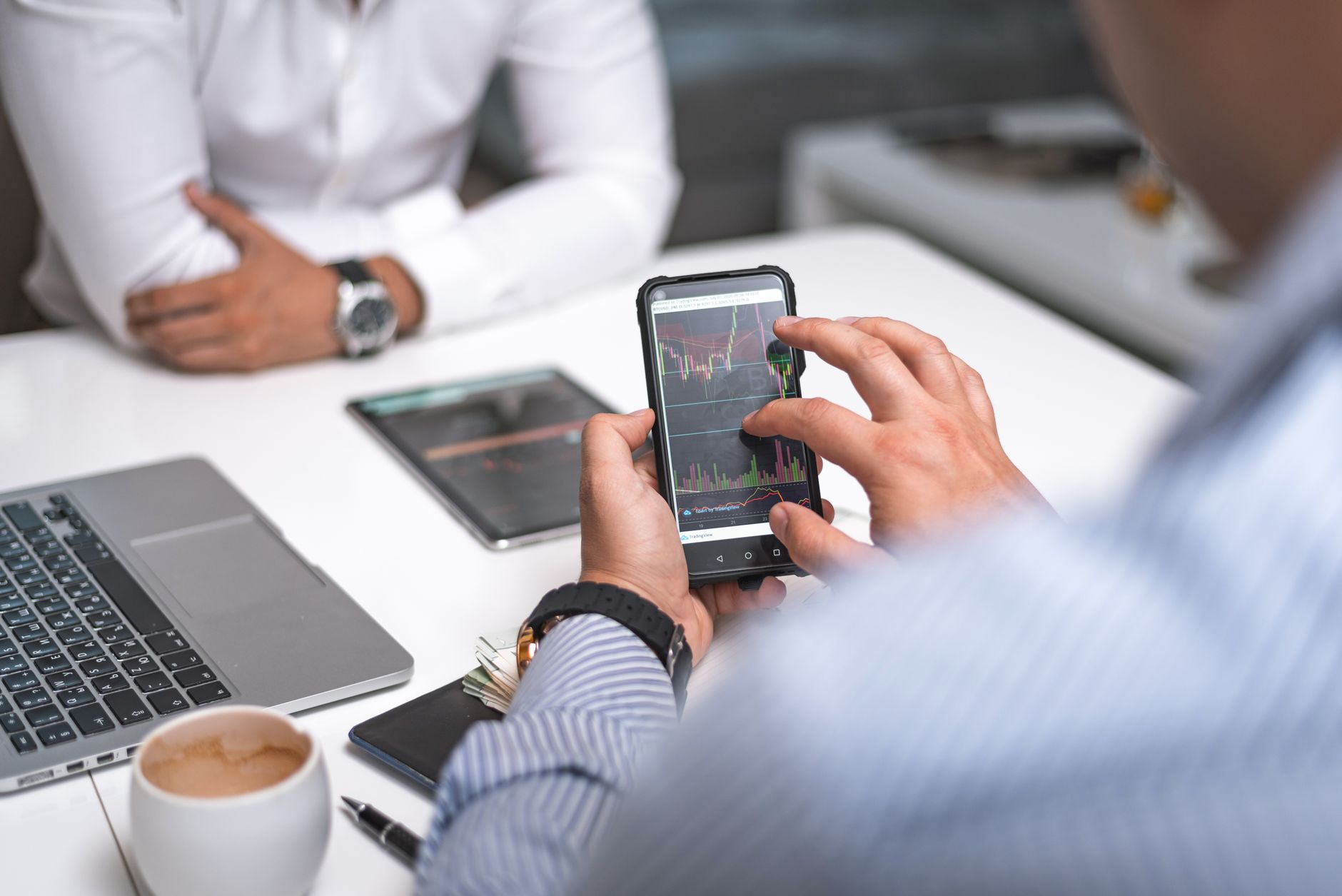 A person reviewing social media analytics on a smartphone