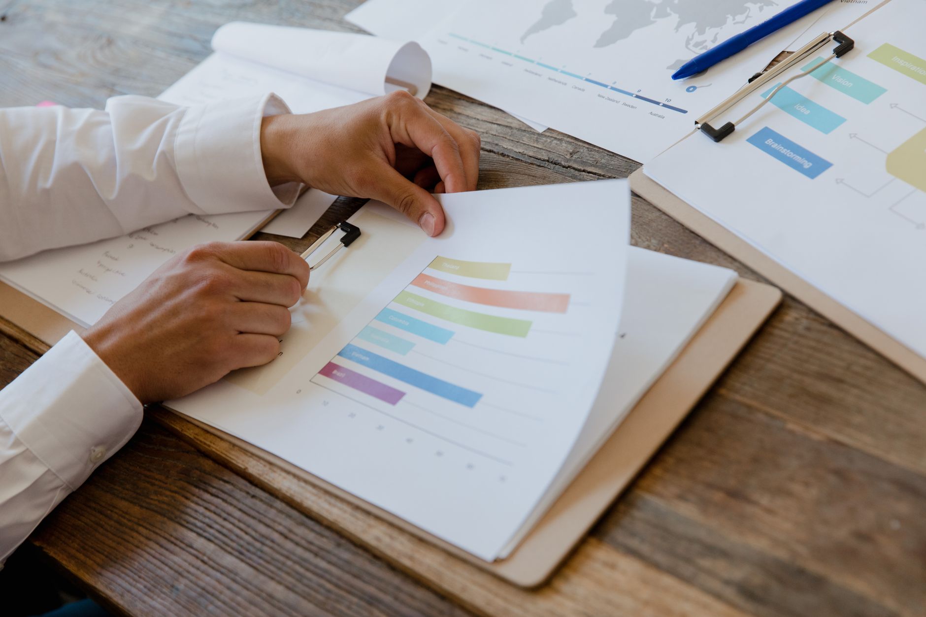 Marketing professional reviewing social media performance report on laptop