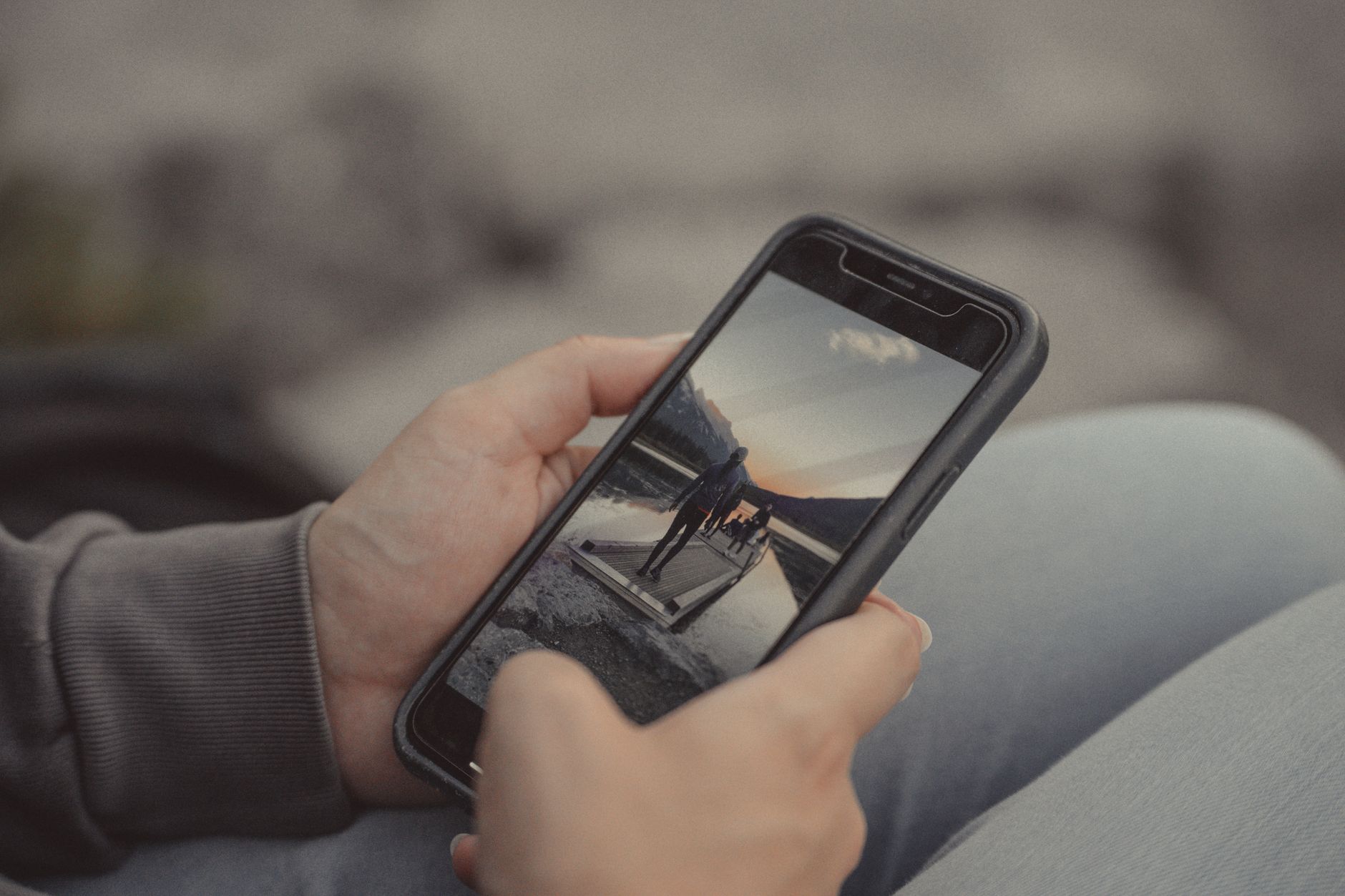 A smartphone displaying a vertical short-form video with animated captions on screen